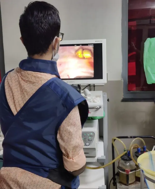 Dr. Nikhil Gandhi, top gastroenterologist in Bikaner, exudes confidence and warmth in his modern medical office.